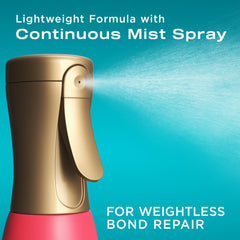 Close-up of OGX Bond Protein Repair heat spray pump for precise mist application.