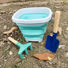 OKGD metal rake with wooden handle, smooth grip for soil loosening.