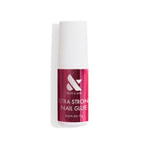 Olive & June Ultra Strong Nail Glue bottle pour showing long-lasting hold for press-ons