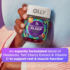 OLLY Berry flavor gummies served with glass of water before sleep.