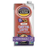 Oregon Chai Spiced Chai concentrate bottle pouring for rich at-home latte