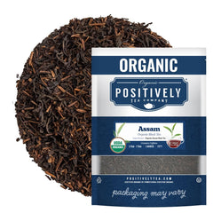 Organic Positively Tea Company Assam TGFOP loose-leaf tea in a bowl, rich aroma ideal for morning ritual.