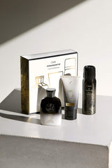 Oribe Gold Repair Restore Conditioner tube promoting moisture and softness.