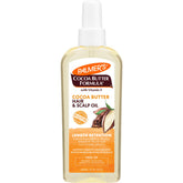 Palmer's Cocoa Butter Biotin Length Oil bottle pour for even hydration