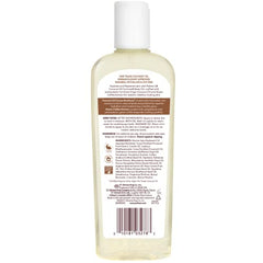 Palmer's Coconut Oil Formula Body Oil pour demonstrating quick absorption and moisture.