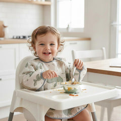 PandaEar blue bib with pocket detail and back tie for adjustable comfort.