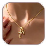 Partm Double Cross Necklace with a delicate round box chain and sparkling cross pendant.