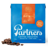 PARTNERS COFFEE ROASTERS Flatiron Blend espresso bag with fresh roast date for peak aroma.