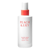 Peach & Lily Glass Skin Veil Mist bottle close-up with cucumber infusion for refreshed skin.