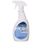 PetArmor home spray bottle applying flea and tick protection to surfaces.