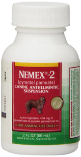Pfizer Nemex-2 wormer bottle pour demonstrates easy dosing for small dogs at home.