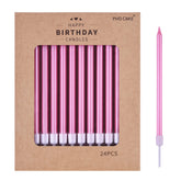 PHD CAKE pink long taper candles on cake for a chic birthday look.