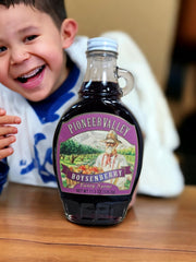 Close-up of Pioneer Valley syrup drizzle emphasizes natural ingredients.