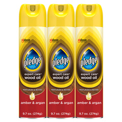 Pledge Expert Care Wood Oil spray bottle revives wood with amber-argan scent.