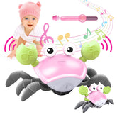 Plnmlls Crawling Crab Toy pink with music and LED lights for engaging tummy time.
