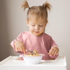 POIKSHARK adjustable neck pink bib for a growing toddler.