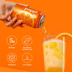 Close-up of bubbles in Poppi orange soda glass