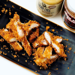 Breaded chicken fingers ready for baking with Pork King Good crumbs.