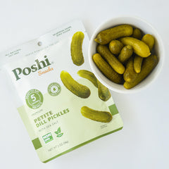 Poshi petite dill pickles 2 oz pack offering 5 calories per serving for a light snack.