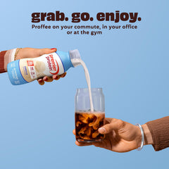 Glass of Premier Protein Shake Vanilla with a creamy appearance.