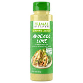 Primal Kitchen Avocado Lime Dipping Sauce bottle on counter for creamy citrus flavor.