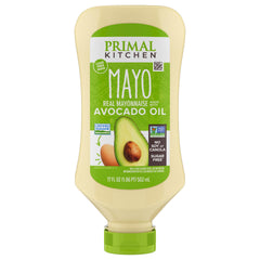 Primal Kitchen Mayo Avocado Oil squeeze bottle pouring for burgers and dips.
