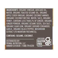 Primal Kitchen Sesame Ginger Vinaigrette on colorful salad bowl.