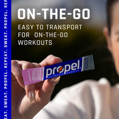 Propel Raspberry Lemonade powder being dispensed for fast hydration.