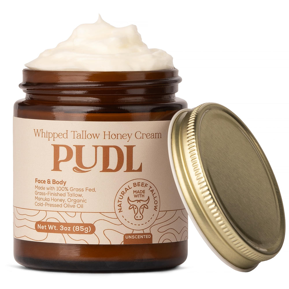 PUDL grass-fed beef tallow honey cream jar showing rich, nourishing texture for skin.