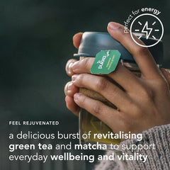 Cup with steaming emerald brew, caffeine-free energy for calm focus.