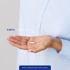 Person taking Pure Encapsulations DHEA 25 mg capsule for daily energy.