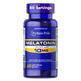 Puritan's Pride Melatonin 10mg bottle on nightstand aids smoother sleep onset