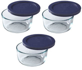 Pyrex 7200 2-cup glass bowl with a dark blue lid for fridge storage and microwave reheats.