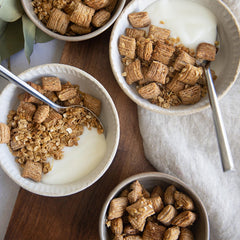 Three-box pack on kitchen table emphasizes value and convenience.