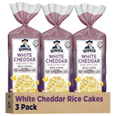 Quaker rice cakes white cheddar pack front, crispy whole grain snack.