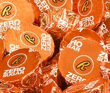 QUEEN JAX sugar-free miniature peanut butter cups close-up shows creamy peanut butter center