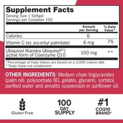 Qunol Mega Ubiquinol bottle with glass demonstrates daily supplementation ritual.