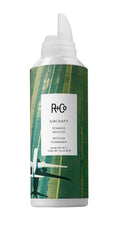 R+Co Aircraft Pomade Mousse bottle front highlights vegan, paraben-free styling for all hair types.