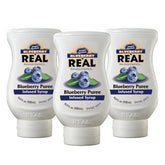 Reàl Infused Exotics Blueberry bottle pour shows drip-free mixing for drinks.