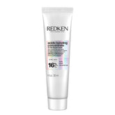 Redken Acidic Bonding Concentrate bottle pour for quick hydration.