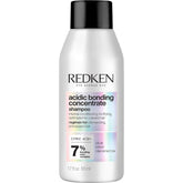 Redken Acidic Bonding Concentrate Shampoo bottle shows color-safe strengthening for damaged hair.