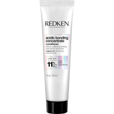 Redken Bonding Concentrate Conditioner bottle close-up highlighting repair benefits for damaged hair