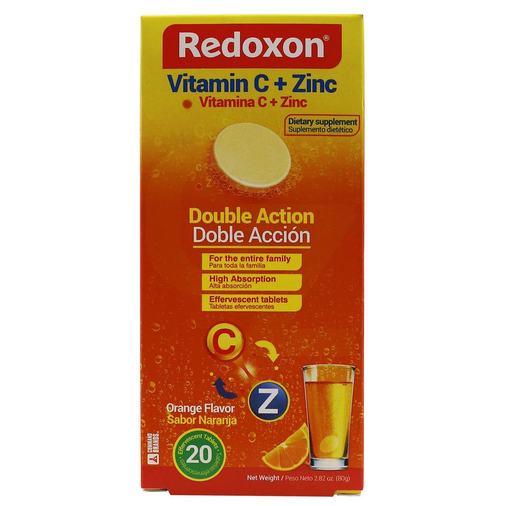 Redoxon orange effervescent tablets in glass fizzing for immune support.