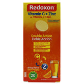 Redoxon orange effervescent tablets in glass fizzing for immune support.