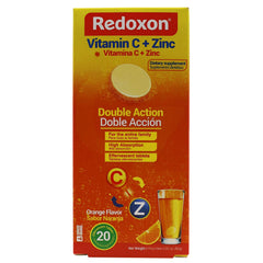 Redoxon orange effervescent tablets in glass fizzing for immune support.