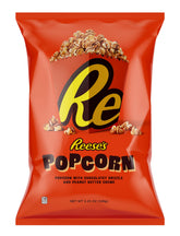 Reese's Popcorn closeup shows chocolate-peanut butter drizzle, a great desk-friendly snack.