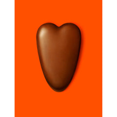 Valentine gift pack featuring Reese's hearts with card and flowers for gifting.