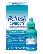 Refresh Contacts eye drops bottle pouring to soothe dry eyes during lens wear.