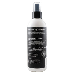 Remooble microfiber cleaning cloth wiping a chalkboard surface clean.
