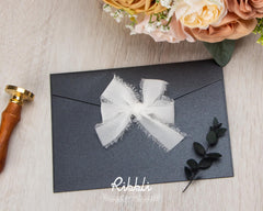 Ribbli white fringe ribbon adds a premium touch to wedding invitations